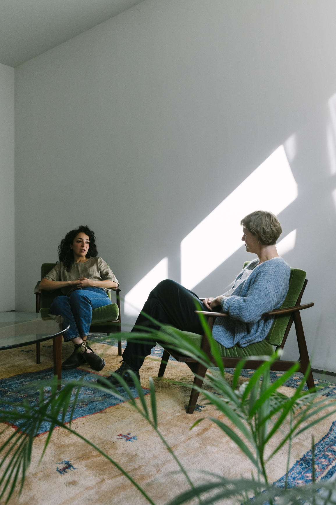 Therapist and patient in comfortable clinical setting